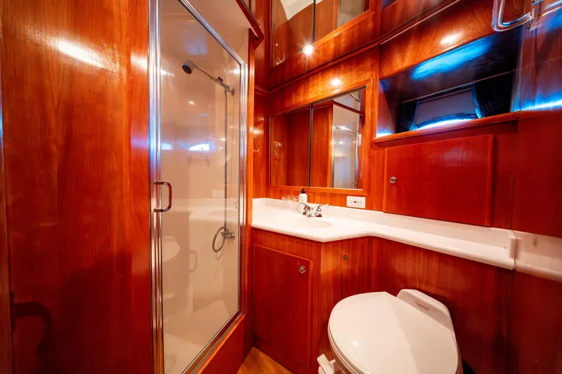  Yacht Photos Pics Luxurious wooden bathroom interior in 2003 Navigator 3900 yacht, featuring shower and vanity.