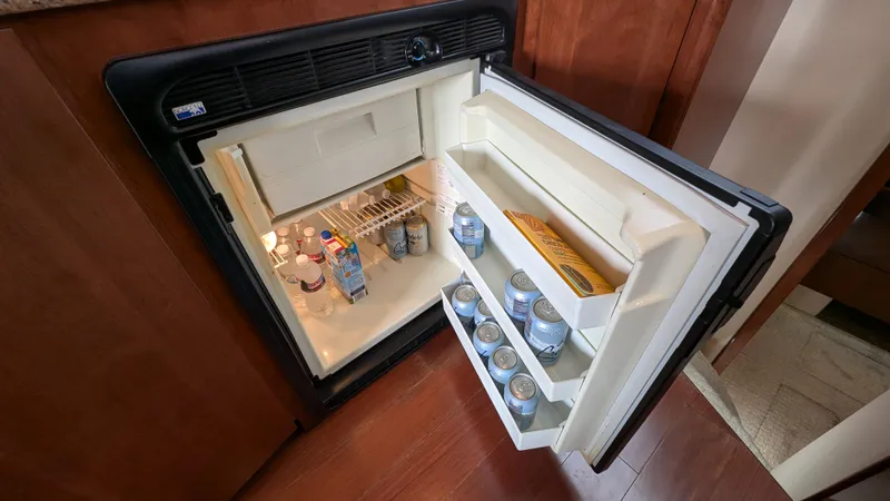  Yacht Photos Pics Open mini fridge in 2008 Meridian 341 Sedan, stocked with drinks and snacks.