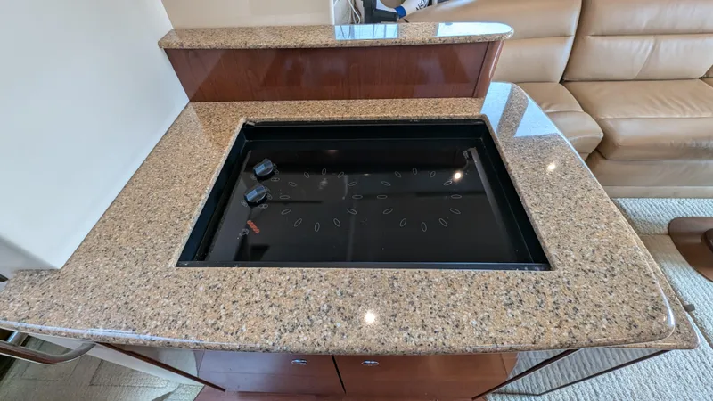  Yacht Photos Pics Granite countertop with built-in stove on 2008 Meridian 341 Sedan yacht interior.