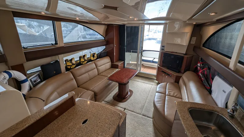  Yacht Photos Pics Luxurious interior of a 2008 Meridian 341 Sedan yacht with leather seating and modern amenities.