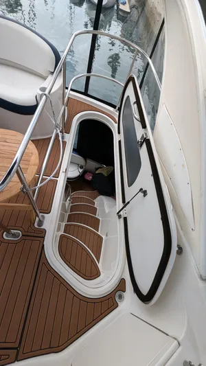  Yacht Photos Pics 2008 Meridian 341 Sedan yacht with open hatch and wooden deck stairs.