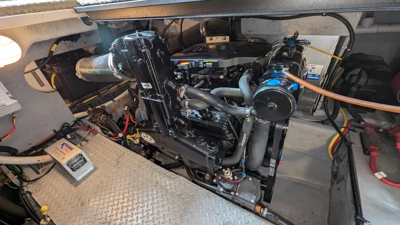  Yacht Photos Pics Engine compartment of a 2008 Meridian 341 Sedan, showcasing mechanical components and wiring.