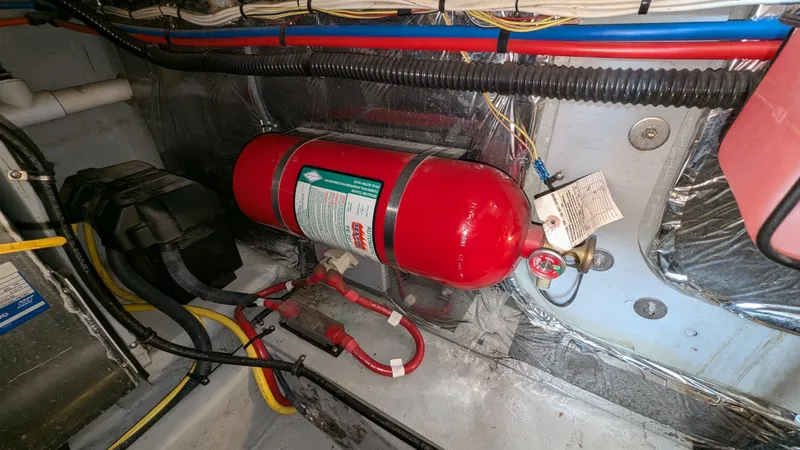  Yacht Photos Pics Engine room of 2008 Meridian 341 Sedan with mounted fire extinguisher.