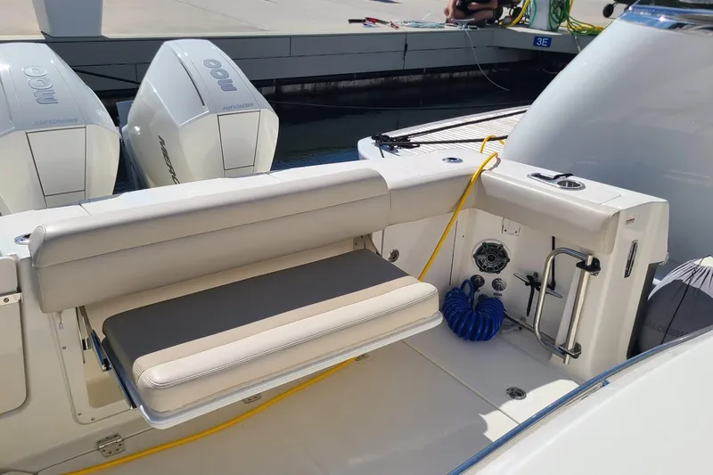 Timber Yacht Photos Pics 2023 Boston Whaler 330 Outrage boat with dual Mercury engines and seating area.