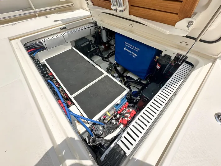  Yacht Photos Pics Engine compartment of a 2021 Boston Whaler 380 Outrage, showcasing detailed components and wiring.