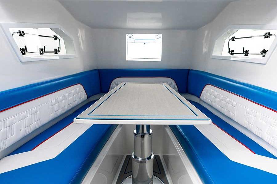 Interior of 2026 American Marine Performance AMP 433 boat with blue and white seating.