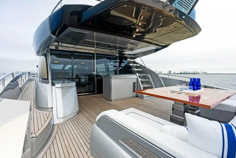Our Trade Yacht Photos Pics Luxury deck of 2021 Riva 88' FOLGORE yacht with modern seating and dining area.