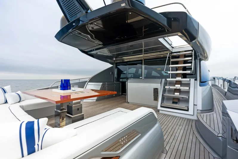 Our Trade Yacht Photos Pics Luxury deck of 2021 Riva 88' FOLGORE yacht with modern seating and dining area.
