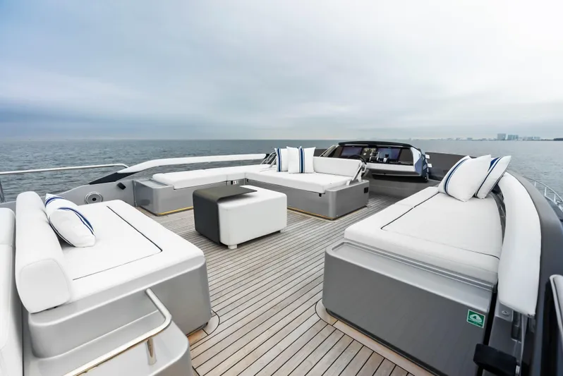 Our Trade Yacht Photos Pics Luxurious deck of 2021 Riva 88' FOLGORE yacht with modern seating and ocean view.