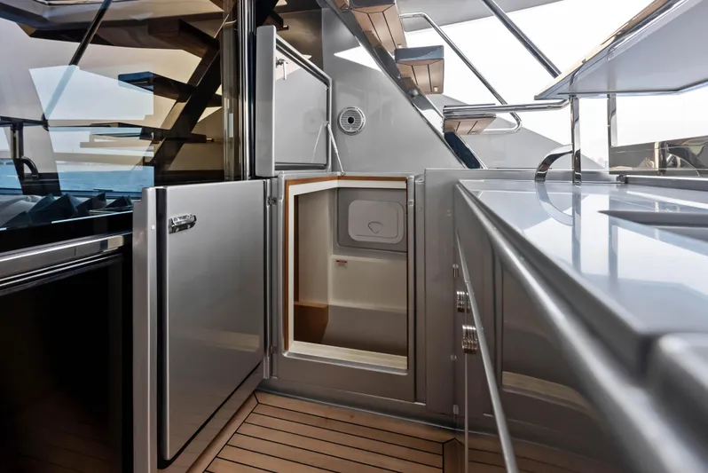 Our Trade Yacht Photos Pics Modern kitchen area on the 2021 Riva 88' FOLGORE yacht with stainless steel appliances.