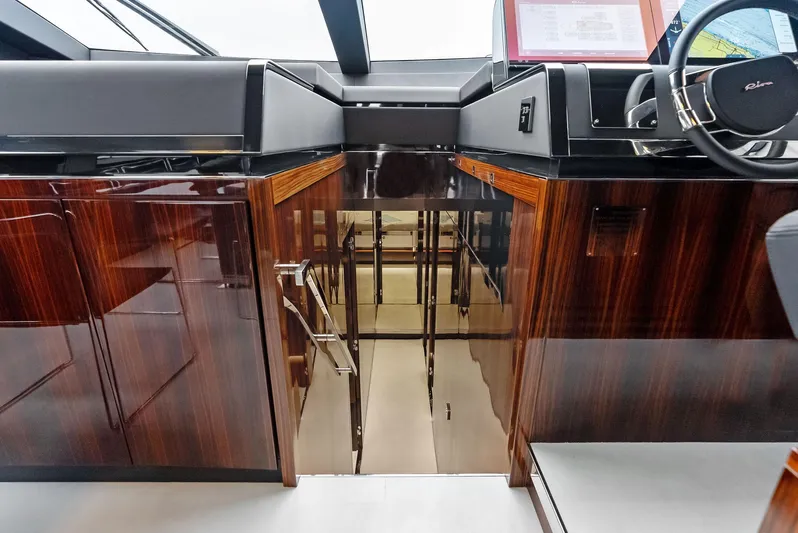 Our Trade Yacht Photos Pics Interior of 2021 Riva 88' FOLGORE yacht with polished wood finishes.