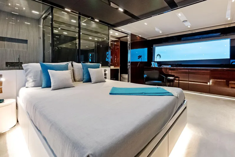Our Trade Yacht Photos Pics Luxurious bedroom interior of 2021 Riva 88' FOLGORE yacht with modern design and ocean view.