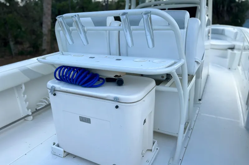  Yacht Photos Pics 2011 Edgewater 318CC boat interior with rod holders and cooler.