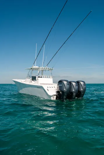  Yacht Photos Pics 2025 Front Runner 36 Center Console boat on open sea with triple engines.