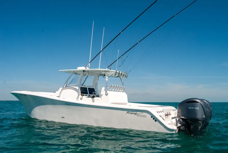  Yacht Photos Pics 2025 Front Runner 36 Center Console boat on open water, equipped with fishing rods.