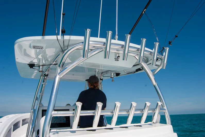  Yacht Photos Pics 2025 Front Runner 36 Center Console boat with fishing rod holders, navigating on open water.