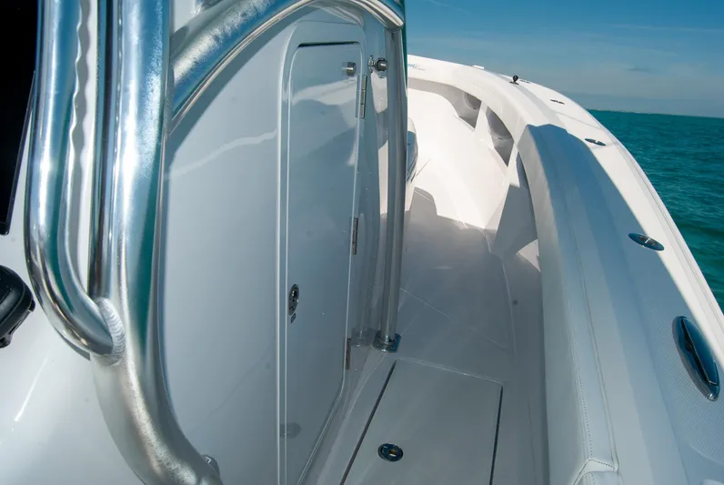  Yacht Photos Pics 2025 Front Runner 36 Center Console boat, sleek design, stainless steel railings, ocean backdrop.