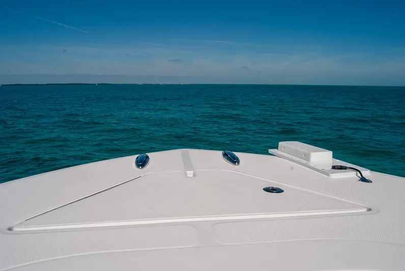  Yacht Photos Pics 2025 Front Runner 36 Center Console boat on open sea under clear blue sky.