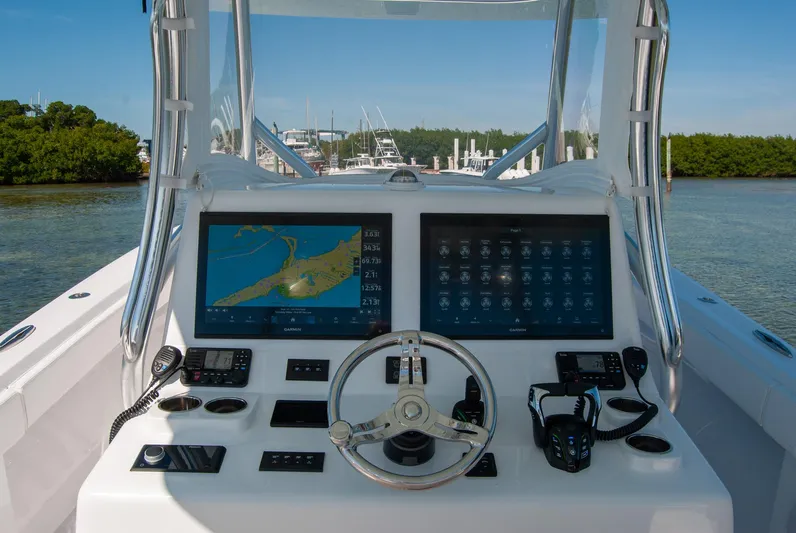  Yacht Photos Pics 2025 Front Runner 36 Center Console boat dashboard with navigation screens and controls.