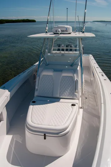  Yacht Photos Pics 2025 Front Runner 36 Center Console boat on calm water, featuring sleek design and advanced technology.