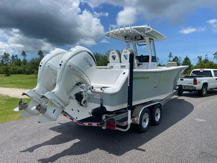  Yacht Photos Pics 2025 Sportsman Open 262 Center Console boat on trailer, dual engines, parked on road.