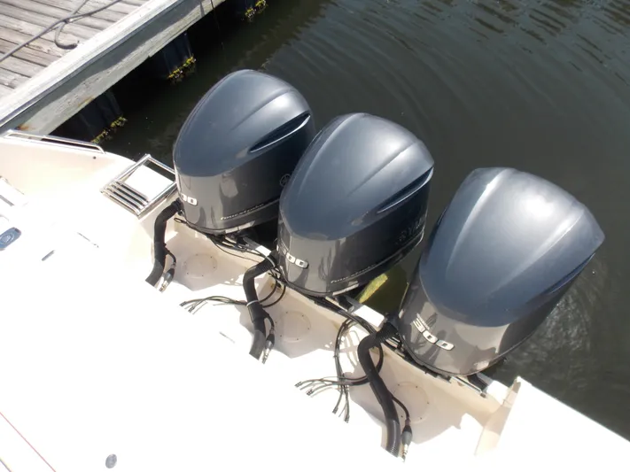  Yacht Photos Pics Three powerful outboard motors on a 2015 Grady-White Express 370 boat.