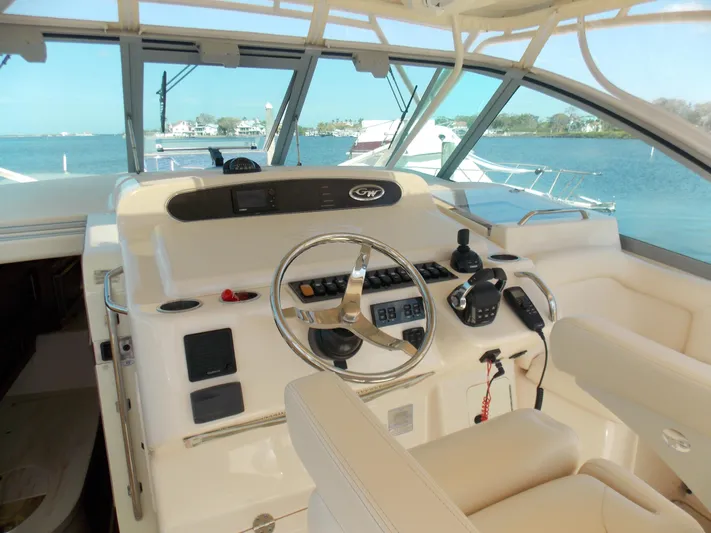  Yacht Photos Pics Helm of 2015 Grady-White Express 370 boat with steering wheel and controls, overlooking water.