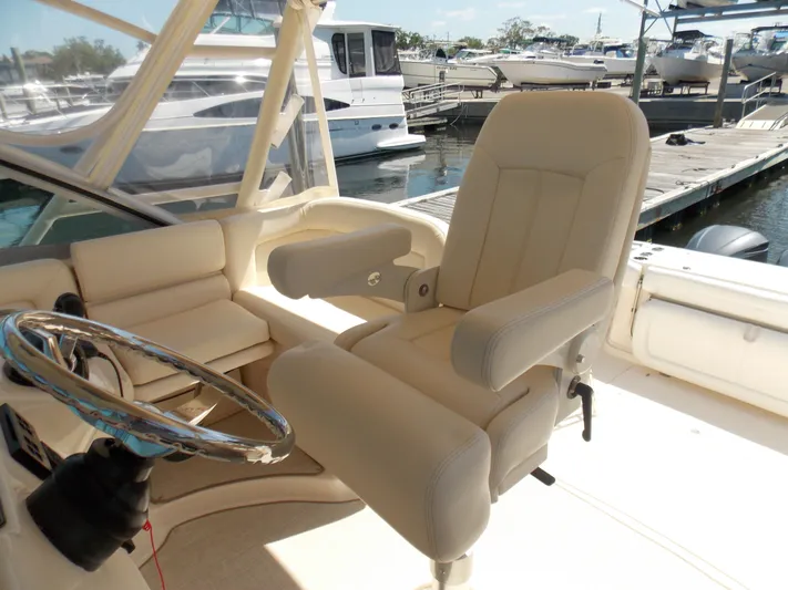  Yacht Photos Pics 2015 Grady-White Express 370 helm with plush seating at marina.