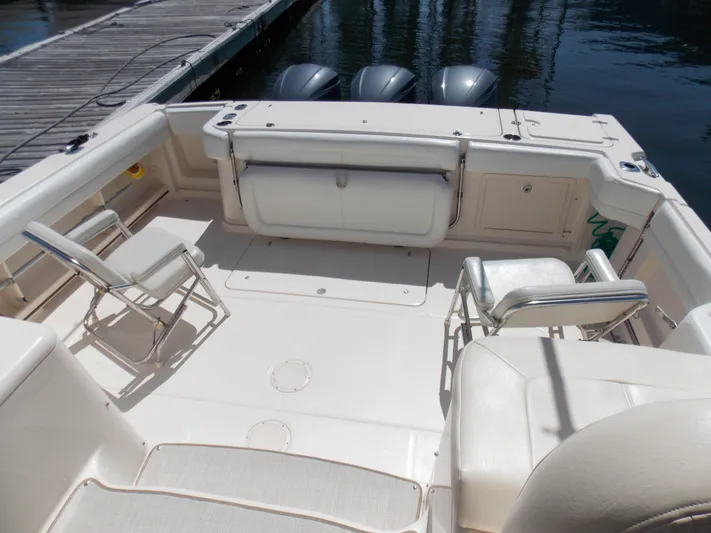  Yacht Photos Pics 2015 Grady-White Express 370 boat deck with seating and triple outboard motors.