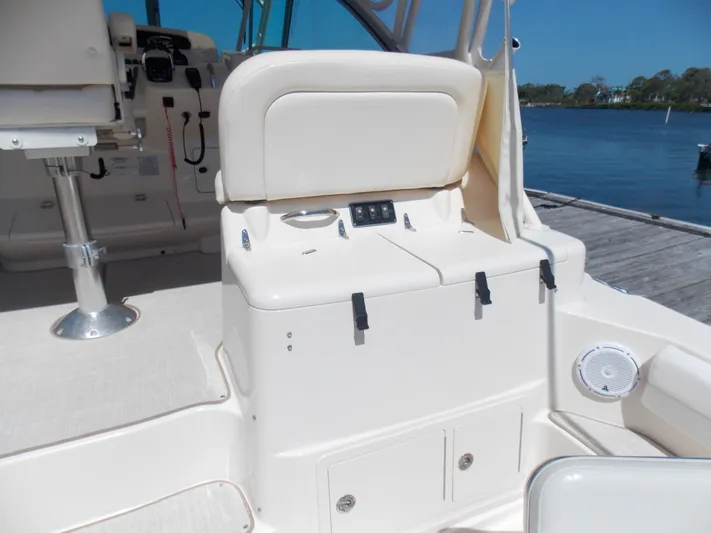  Yacht Photos Pics 2015 Grady-White Express 370 boat interior, featuring seating and control panel by the water.