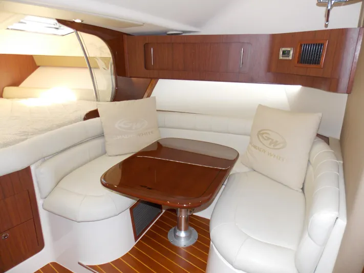  Yacht Photos Pics 2015 Grady-White Express 370 cabin interior with elegant seating and wooden table.