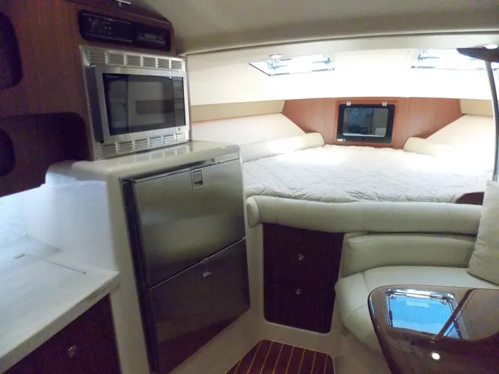  Yacht Photos Pics Interior of 2015 Grady-White Express 370 boat with bed, microwave, and fridge.