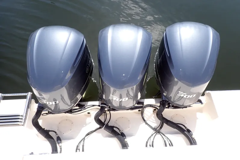  Yacht Photos Pics Three powerful outboard motors on a 2015 Grady-White Express 370 boat.