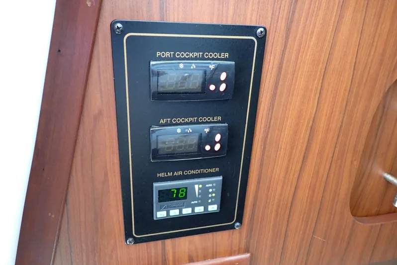  Yacht Photos Pics Control panel for Grady-White Express 370, featuring cockpit coolers and helm air conditioner.