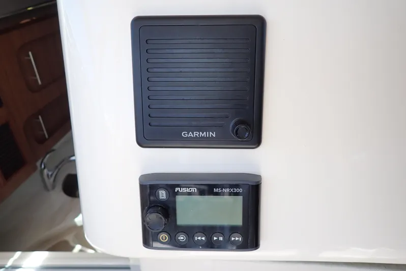  Yacht Photos Pics Garmin and Fusion audio equipment on 2015 Grady-White Express 370 boat dashboard.