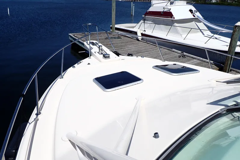  Yacht Photos Pics 2015 Grady-White Express 370 boat docked at marina, sunny day, calm waters.