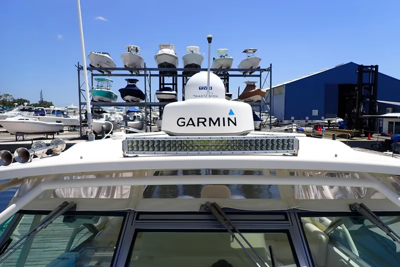  Yacht Photos Pics 2015 Grady-White Express 370 boat with Garmin equipment at a marina, boats in background.