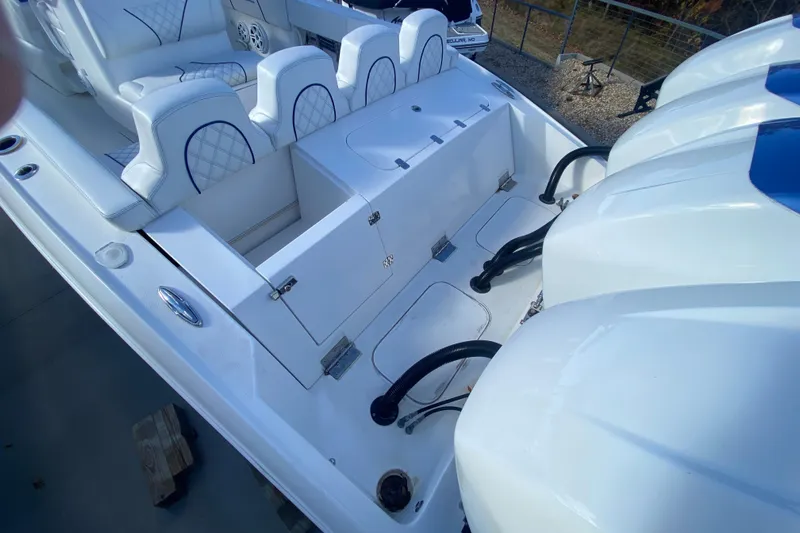  Yacht Photos Pics 2017 Midnight Express 39S Cuddy boat interior with seating and engine view.