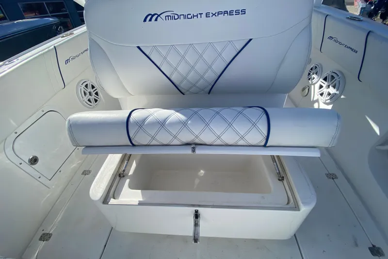  Yacht Photos Pics 2017 Midnight Express 39S Cuddy boat interior with cushioned seating and storage compartment.