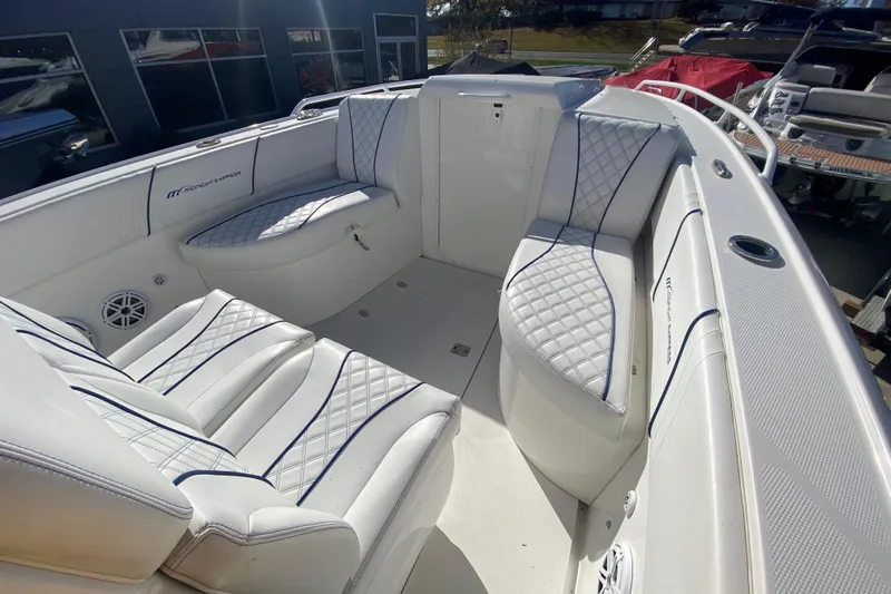  Yacht Photos Pics 2017 Midnight Express 39S Cuddy boat interior with white quilted seating.