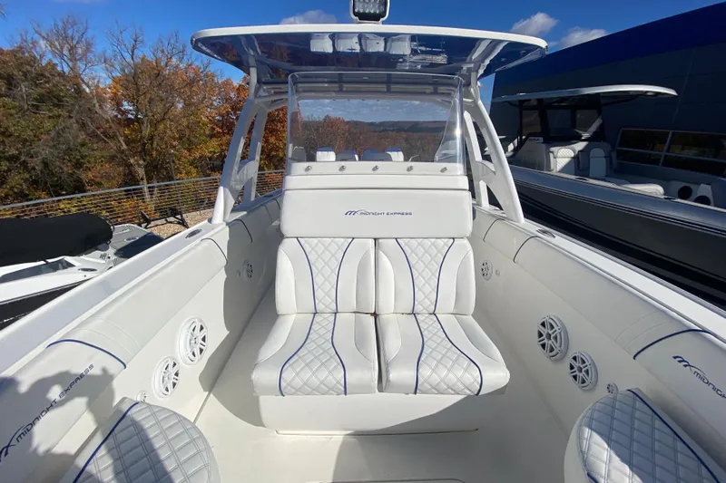  Yacht Photos Pics 2017 Midnight Express 39S Cuddy boat interior with white seating and blue accents.