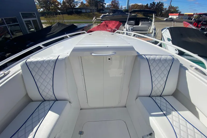  Yacht Photos Pics 2017 Midnight Express 39S Cuddy boat interior with white cushioned seating and blue accents.