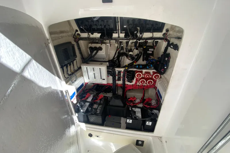  Yacht Photos Pics Electrical system inside a 2017 Midnight Express 39S Cuddy boat, showcasing wiring and components.