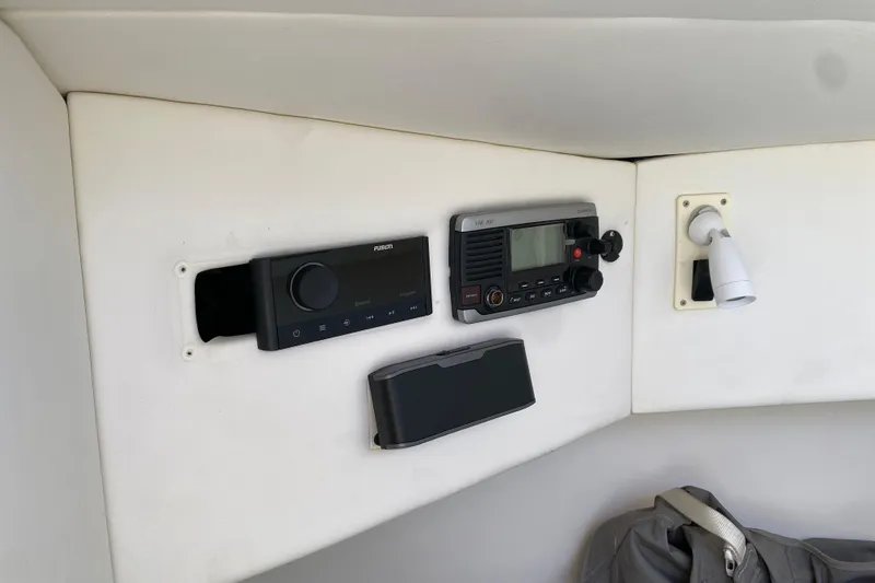  Yacht Photos Pics Control panel of 2017 Midnight Express 39S Cuddy with radio and light fixture.