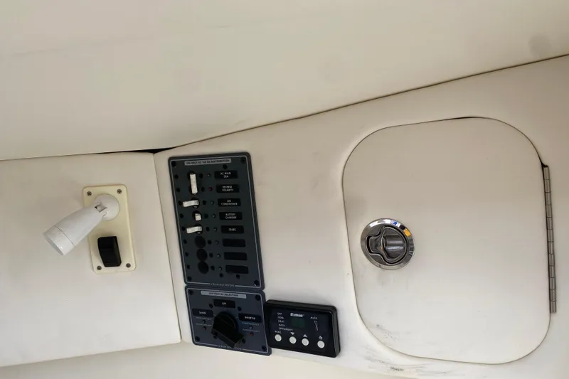  Yacht Photos Pics Control panel and storage compartment on a 2017 Midnight Express 39S Cuddy boat.