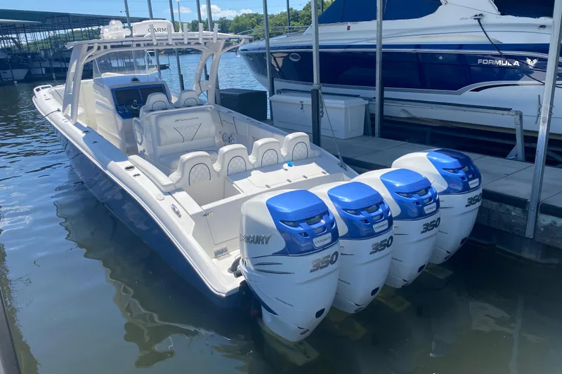  Yacht Photos Pics 2017 Midnight Express 39S Cuddy boat with four Mercury 350 engines docked in marina.