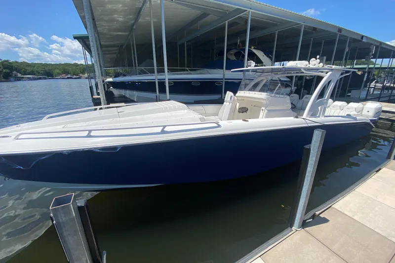  Yacht Photos Pics 2017 Midnight Express 39S Cuddy boat docked, featuring sleek design and spacious seating.