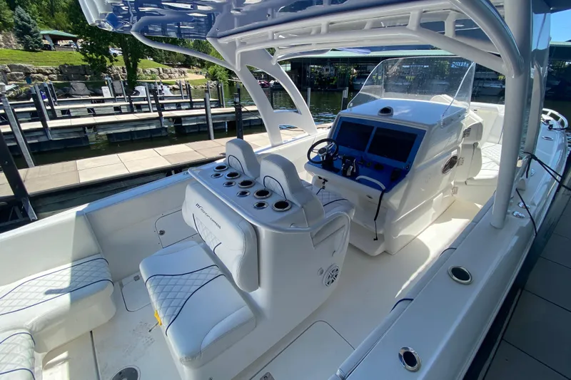  Yacht Photos Pics 2017 Midnight Express 39S Cuddy boat interior with helm, seating, and dockside view.