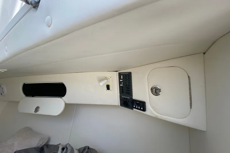  Yacht Photos Pics Interior of 2017 Midnight Express 39S Cuddy boat, featuring control panel and storage compartments.