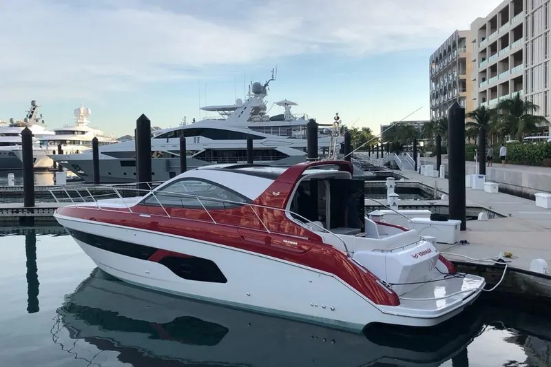  Yacht Photos Pics 2020 Azimut Nexus X47 yacht docked at a marina, featuring sleek red and white design.